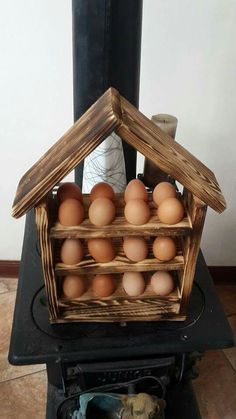 a basket filled with eggs sitting on top of a stove