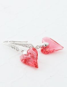 "Handmade Earrings feature gorgeous indian pink swarovski hearts. The crystals have been carefully attached to rhodium plated sterling silver ear wire with tiny cubic zirconia rhinestones. They are perfect for a romantic Valentine's gift. The crystals measure 1/2\" (12mm) and the whole earrings around 1 1/4\" (31mm). PACKAGING: I will send your gorgeous jewelry carefully packed and ready for gift giving. SHIPPING: I ship (nationally and internationally) within a few days of cleared payment excep Gift For Mom From Daughter, Indian Pink, Backdrops Necklace, Swarovski Heart, Pink Swarovski, Back Necklace, Earrings Heart, Swarovski Crystal Earrings, Wedding Jewelry Earrings