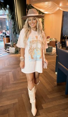 Country Concert Outfit Big Tshirt, Nashville Pool Party Outfit, Oversized Tshirt Cowgirl Boots, Western Outfits Women Tshirt, Country Concert Outfit Tshirt Dress, Country Concert Outfit Summer Dress, White Ankle Cowgirl Boots Outfit, Country Concert Outfit Oversized Tee