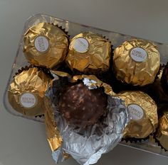 there are chocolates wrapped in foil on top of each other and placed next to each other