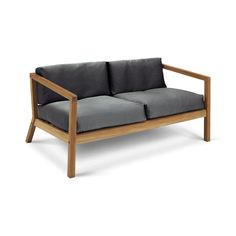 a wooden couch with grey cushions on it