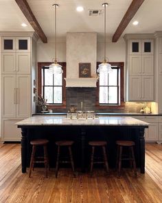 a large kitchen with an island in the middle