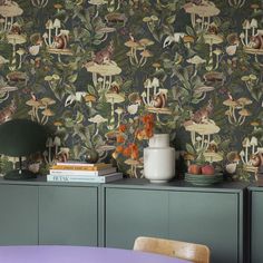 the wallpaper is very colorful and has animals on it