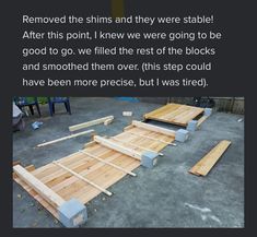 some wooden planks laying on the ground next to each other with words above them