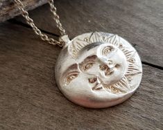 This celestial sun and moon pendant necklace is made by using the ancient lost wax technique and it is hand forged. It comes in a sterling silver chain of your choice or a waxed cord and the pendant is 23gr solid sterling silver made in great detail. A unique, ethereal piece of jewelry that will add character to any look and is ideal as a gift to yourself or to someone special. The total length of the chain is 460mm, please contact me if you would like me to custom made the length of your chain. Celestial Sun And Moon Sterling Silver Necklace, Celestial Sterling Silver Necklace With Sun Design, Sterling Silver Sun And Moon Spiritual Necklace, Silver Celestial Necklace With Sun Design, Sterling Silver Sun Design Spiritual Necklace, Sterling Silver Spiritual Necklace With Sun And Moon Design, Spiritual Sterling Silver Necklace With Sun And Moon Design, Sterling Silver Necklace With Sun Design, Spiritual Sterling Silver Sun And Moon Necklace