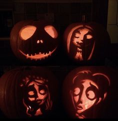 three pumpkins with faces carved into them