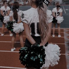 the cheerleaders are dressed in black and white