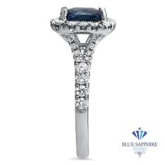 a blue sapphire and diamond ring with diamonds on the band, set in white gold