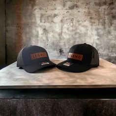 This hat is perfect for the dad and son in your life, engraved patch says Legacy for son and our matching hat for the Dad says Legend, both hats come together in this set. We craft our products by hand and with love right here in Texas. All our hats are the best selling Richardson trucker hats. Father's Day Snapback Hat With Leather Patch, Brown Hats For Father's Day Outdoor, Brown Outdoor Hats For Father's Day, Brown Outdoor Hat For Father's Day, Father's Day Brown Hat With Leather Patch, Father's Day Black Hat With Curved Brim, Black Curved Brim Hat For Father's Day, Father's Day Brown Curved Brim Hat, Father's Day Outdoor Brown Hat