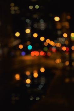 blurry photograph of city lights at night