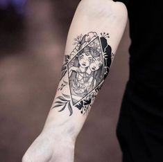 a woman's arm with a tattoo on it and an arrow in the middle