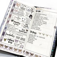 an open planner book with stickers and writing on the pages is shown in this image