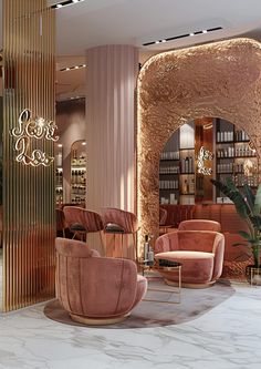 the lobby is decorated with gold and pink chairs, bookshelves, and chandeliers