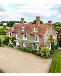 an aerial view of a large brick house