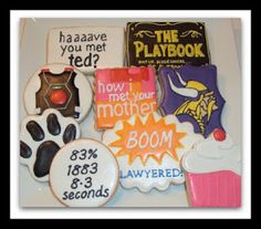 decorated cookies are arranged in the shape of dogs paws, books, and more