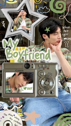 a man sitting in front of a camera on top of a poster with the words my boyfriend