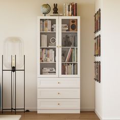 a white bookcase with many books in it