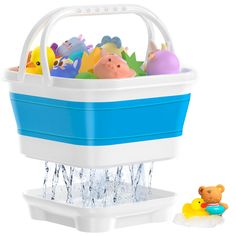 an ice bucket filled with lots of toys next to a toy rubber ducky in the water