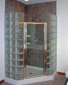 a bathroom with a walk in shower next to a sink