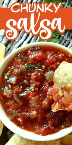 a bowl of chunky salsa with tortilla chips