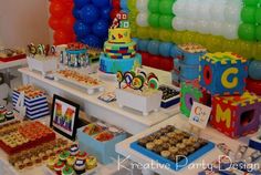 a table filled with lots of cupcakes and desserts on top of it