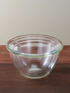 a glass bowl sitting on top of a wooden table