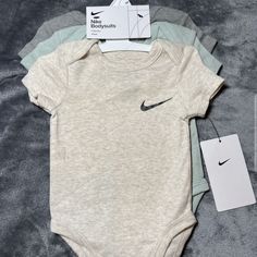 Product Description: Dress Your Little One In Style And Comfort With This Nike Bodysuits 3-Pack! Perfect For Infants Aged Newborn, 3, 6, 9 Months, These Bodysuits Are Crafted From Soft, Breathable Fabric To Keep Your Baby Cozy All Day. The Pack Includes Three Adorable Colors, Featuring The Classic Nike Swoosh For A Sporty Touch. With Easy Snap Closures For Quick Changes And A Comfortable Fit, These Bodysuits Are Essential For Any Baby Wardrobe. Give Your Baby The Comfort They Deserve While Showc Baby Accessories Must Have, Nike Baby Clothes, Baby Bottle Set, Boy Baby Clothes, Newborn Baby Boy Clothes, Baby Clothes Boy, Baby Wardrobe, Baby Boy Stuff