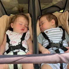 two small children sleeping in their carseats