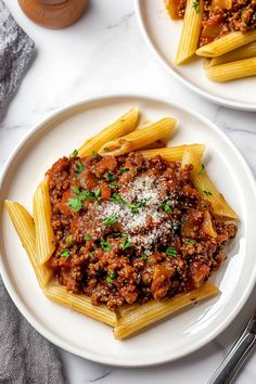 This hearty and comforting penne bolognese features al dente pasta tossed in a rich beef sauce. It's perfect for family dinners or meal prepping!