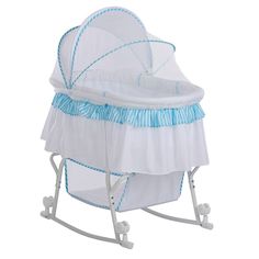 a white and blue baby crib with wheels