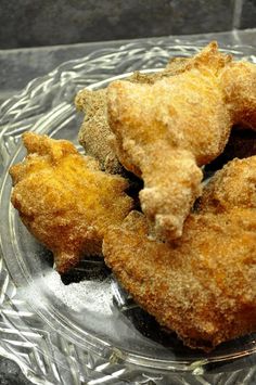 three fried food items on a glass plate