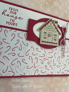 a close up of a greeting card with a house on the front and bottom corner