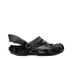 Crocs Batman Batmobile Classic Men's/Women's Clog It's high-octane style. The Batman Batmobile Classic Clog is ready to own the night (and the day) with a design inspired by Batman’s ride — right down to the bat wings on the side of the strap. And you can customize your new favorite mode of transportation, with Jibbitz™ charms. To the Batcave!   Incredibly light and fun to wear Water-friendly and buoyant; weighs only ounces Ventilation ports add breathability and help shed water Batman Crocs, The Batman Batmobile, The Batcave, Black Crocs, Batman Batmobile, Rack Room Shoes, Rack Room, The Batman, Womens Clogs