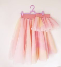 "Wonderful rainbow mom and me tulle skirts, perfect for everyday wear, fancy photo shoot or all those special occasions! Our mother daughter tutus made for you and your little girl, to look and feel just wonderful. Those skirts will soon become your favourite outfits, and you'll definitely be an appereance everywhere, especially if you wear them with sneakers :) So many possibilities, the sky is the limit! ❤ MADE ESPECIALLY FOR YOU The skirts are available on different options, please select the Girls Tulle Skirt, Matching Tshirts, Unicorn Outfit, Layered Tulle Skirt, Girls Skirts, Mom And Me, Tulle Skirts, Woman Outfit