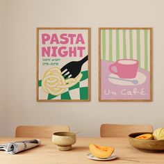 two posters on the wall above a table with food and utensils in bowls