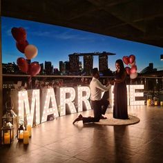 a man and woman dancing in front of the word married