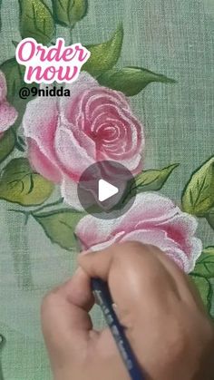 someone is drawing roses on the fabric with a marker and pencil, which reads order now @ india