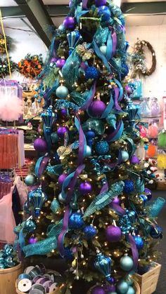 a christmas tree with blue and purple ornaments