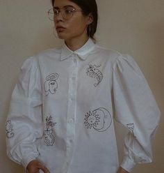 Oversized Cotton Blouse With Balloon Sleeves, Cotton Embroidered Puff Sleeve Blouse, Cotton Blouse With Embroidered Sleeves, Cotton Relaxed Fit Shirt With Puff Sleeves, Relaxed Fit Cotton Shirt With Puff Sleeves, Cotton Puff Sleeve Shirt In Relaxed Fit, White Blouse With Blouson Sleeves And Relaxed Fit, White Puff Sleeve Tops With Embroidered Sleeves, Cotton Blouse With Embroidered Puff Sleeves