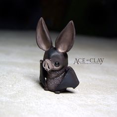 a small toy bat sitting on top of a table