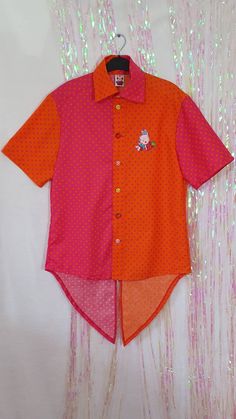 Super kawaii! This cerise pink and orange polka dot, masculine fit shirt is so FUN! Wear it loose and layered and let the shirt tails hang down at the back, or button it up and wear it fitted with some cute decora belts and accessories... style it how you want! This is a one off item, ready to ship! Traditional men's shirt size M - 36" chest, straight fit and wide shoulders. Cute little bright decora buttons and strawberry bunny patch finish off this happy piece! Cute Orange Short Sleeve Shirt, Fun Orange Short Sleeve Shirt, Playful Pink Shirt For Summer, Cute Orange Cotton Shirt, Fitted Pink Cute Shirt, Pink Outfits Plus Size, Strawberry Bunny, Wide Shoulders, Mens Dress Shirts