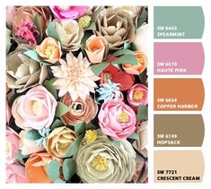 the color scheme for this flower arrangement is peach, pink, green and brown with different flowers