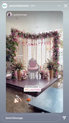 the wedding stage is decorated with pink flowers and greenery