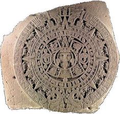 an ancient stone with designs on it