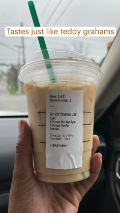 someone holding up a cup of iced coffee in their hand with the text, tastes just like teddy grahams