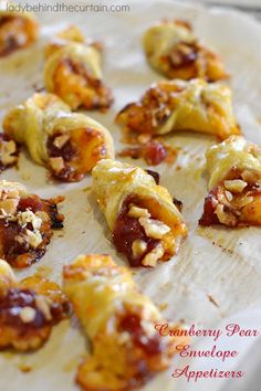 cranberry pear envelope appetizers are on a baking sheet and ready to be eaten