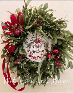 a christmas wreath hanging on the side of a wall