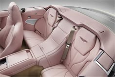 the interior of a car with pink leather