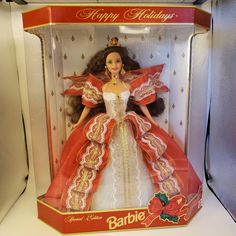 a barbie doll in a red and white dress with gold trimmings on it's head