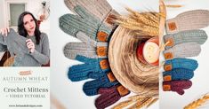 a woman holding a lit candle in front of an autumn wreath made out of crochet mittens